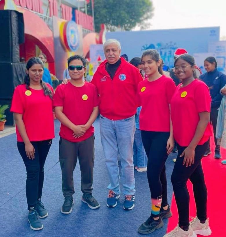 Fitness boot camp with obstacle course, trainers motivating participants, outdoor setting with professional equipment, dynamic group exercise