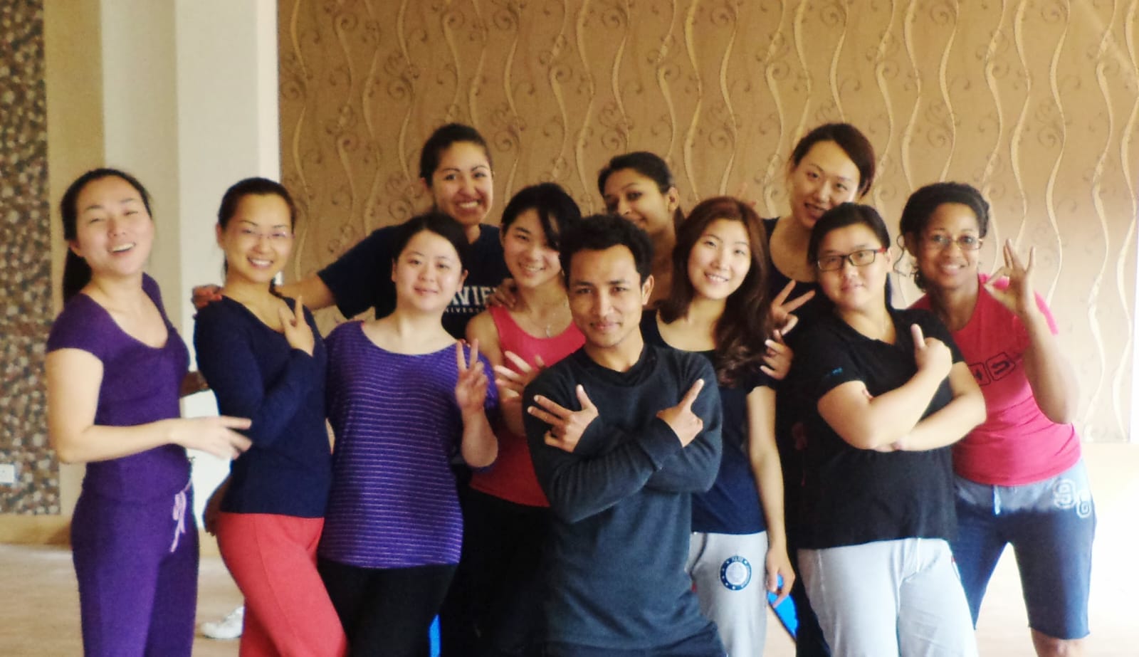 Marathon event with runners at starting line, colorful racing bibs, professional timing equipment, spectators cheering, and energetic atmosphere